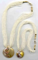 Round Avorio Oro Pendant and Seed Beads.