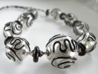 Black Spirals on White Gold Foil Bead Necklace