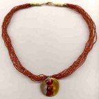 Silver, Red, Gold Pendant on Red Seed Beads